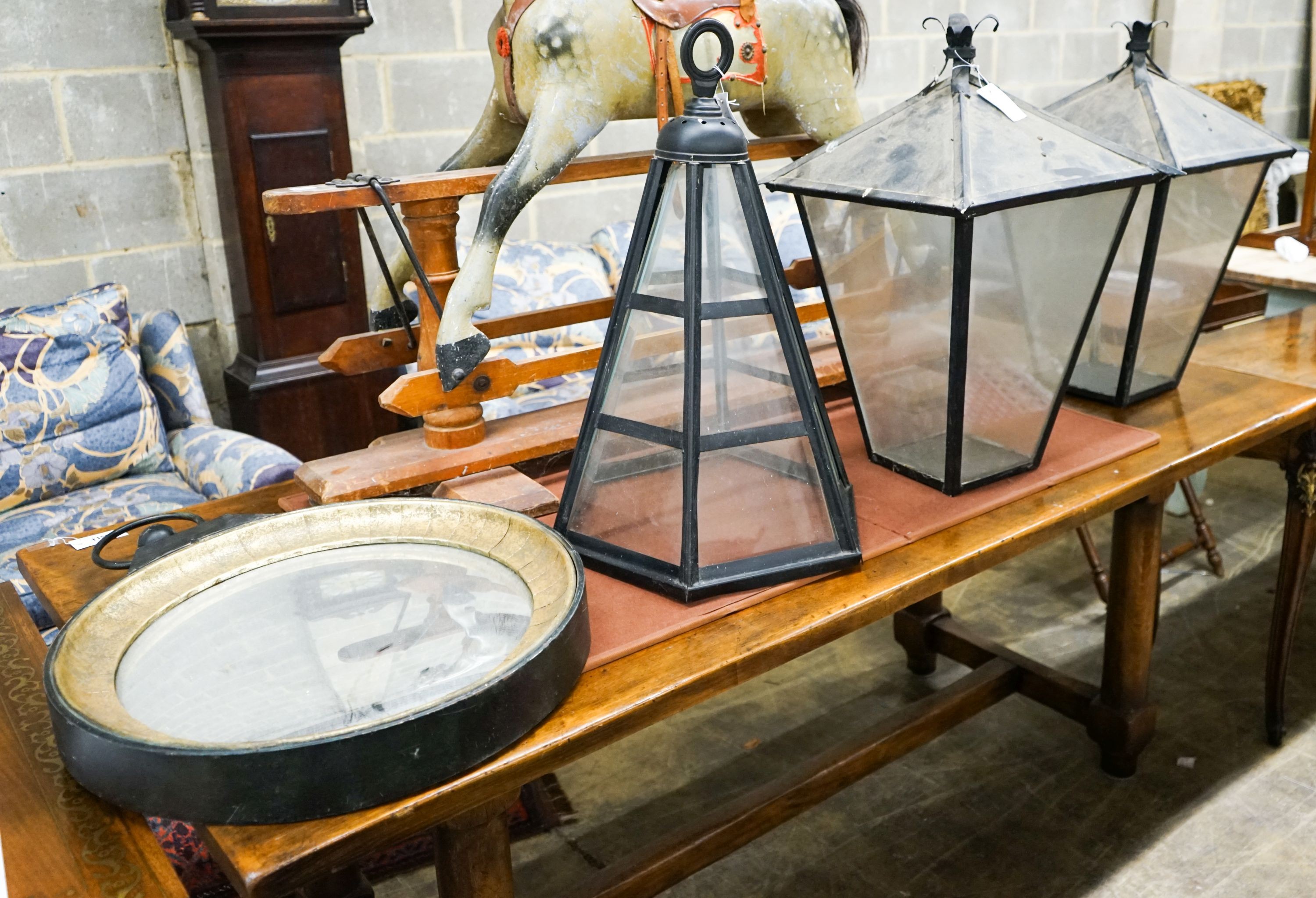 A pair of Victorian style black metal square lanterns, height 68cm together with one other and a reproduction convex wall mirror